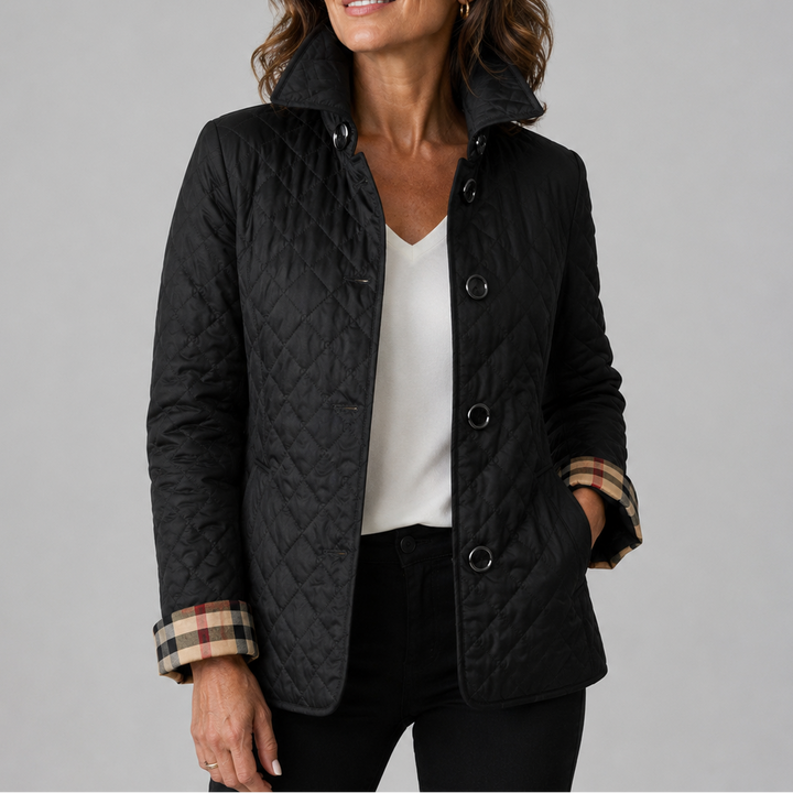 Delia lightweight quilted jacket in black, worn over a white top
