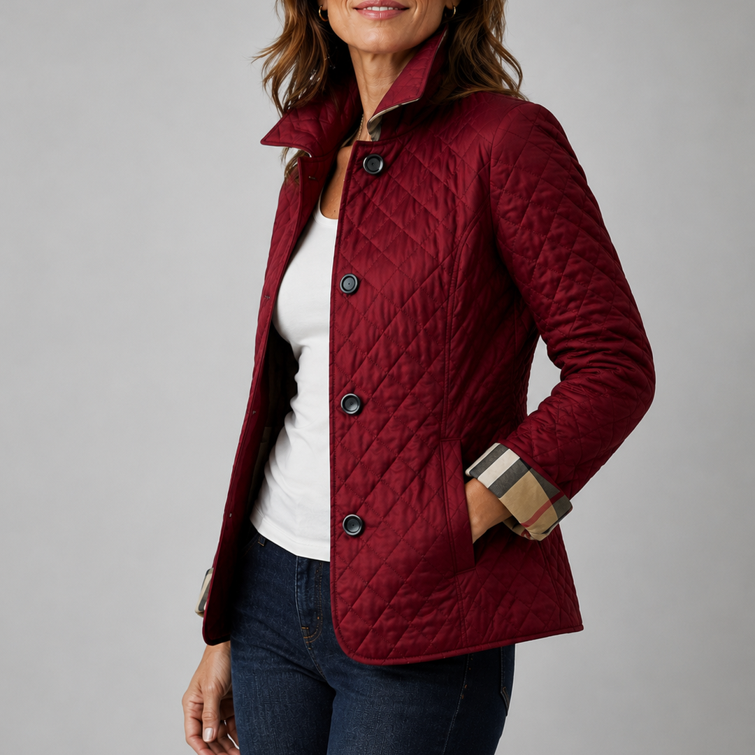 Delia lightweight quilted jacket in red, worn over a white tee and jeans