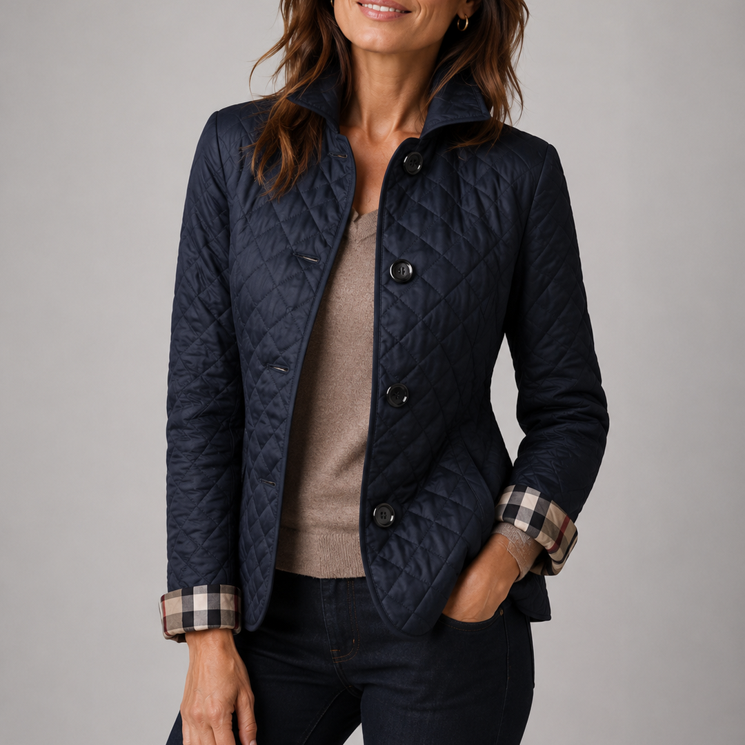 Delia lightweight quilted jacket in navy, worn over a fine knit