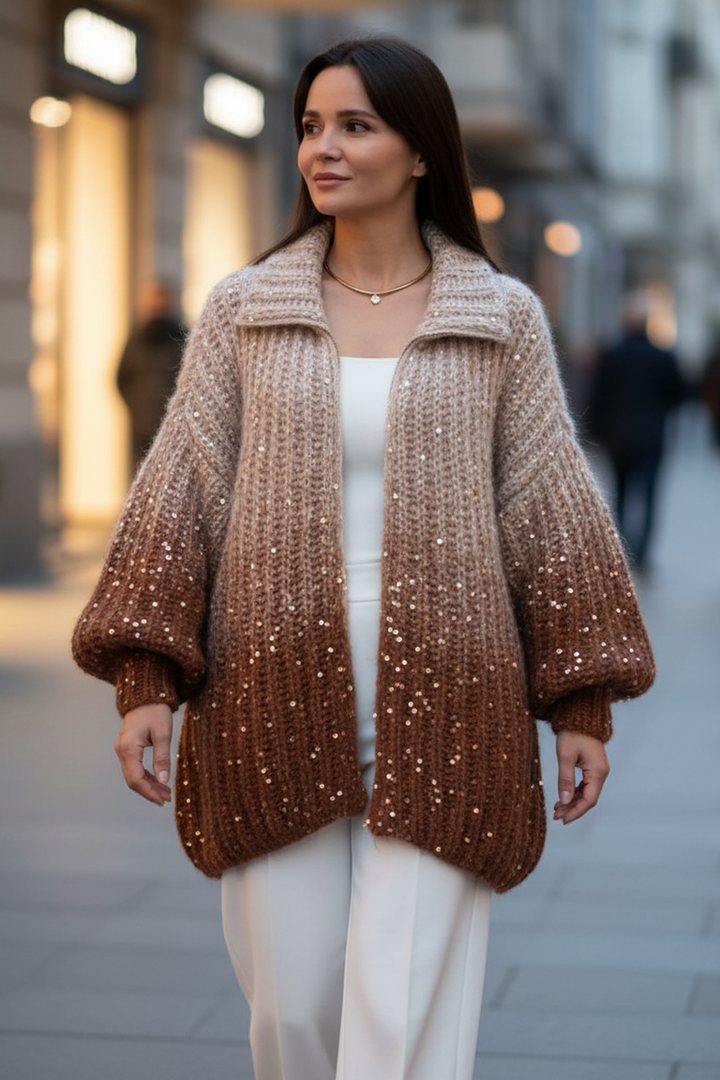 Winifred sequin zip-up cardigan in coffee-brown sequins worn open over a white top and white wide-leg trousers