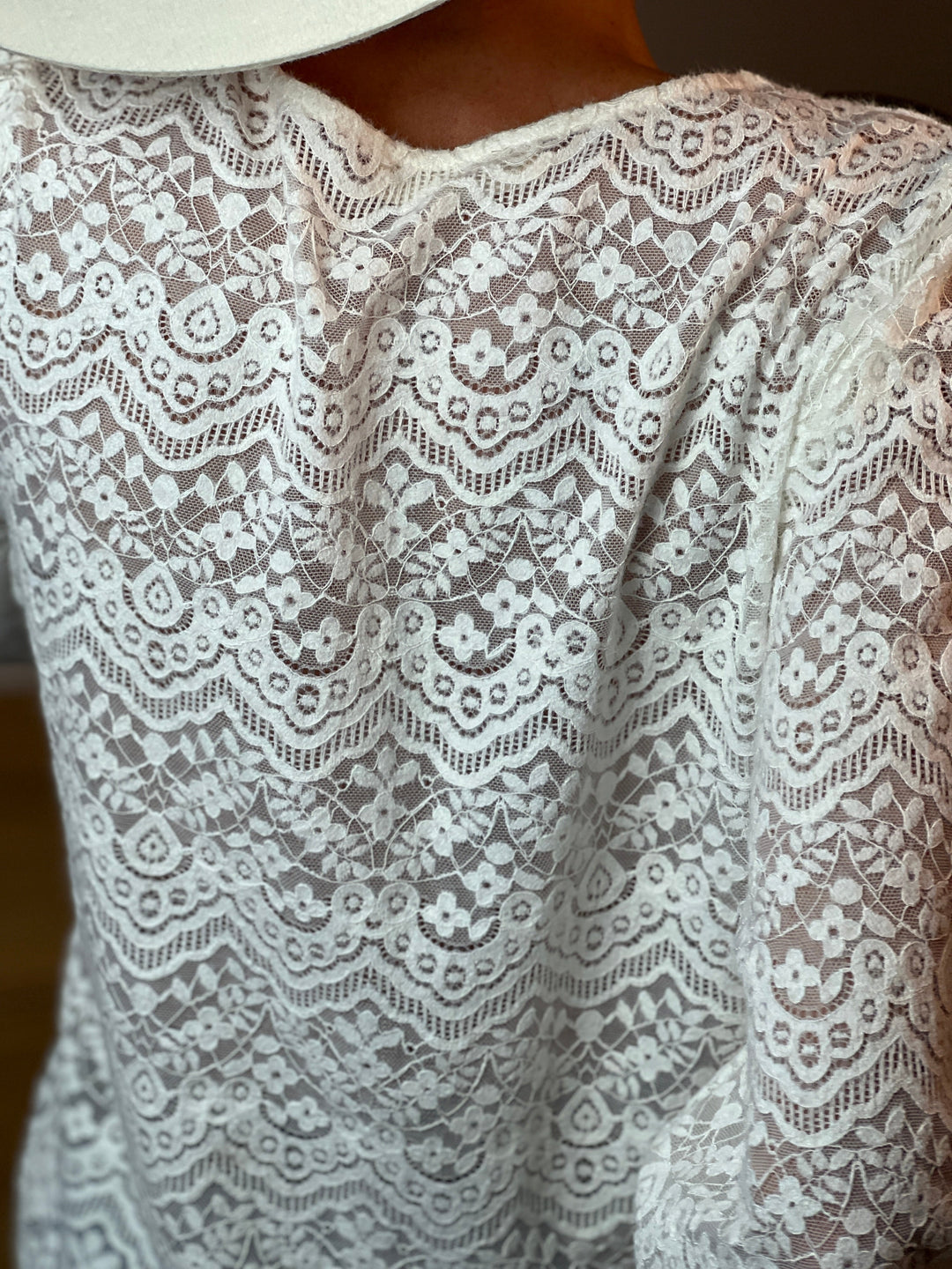 Detail of the Hedda blouse back: tonal knit-lace texture in Beige
