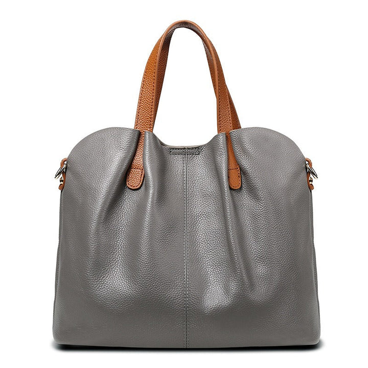 Gemma genuine leather handbag in gray litchi grain leather, front view showing the gathered top and silver-toned hardware