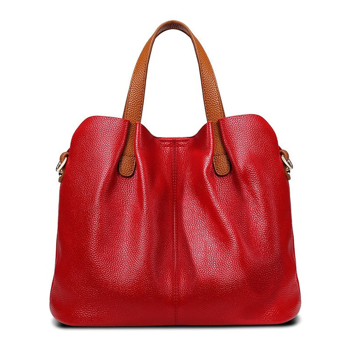Gemma genuine leather handbag in red litchi grain leather with tan top handles and a soft, slouchy shape